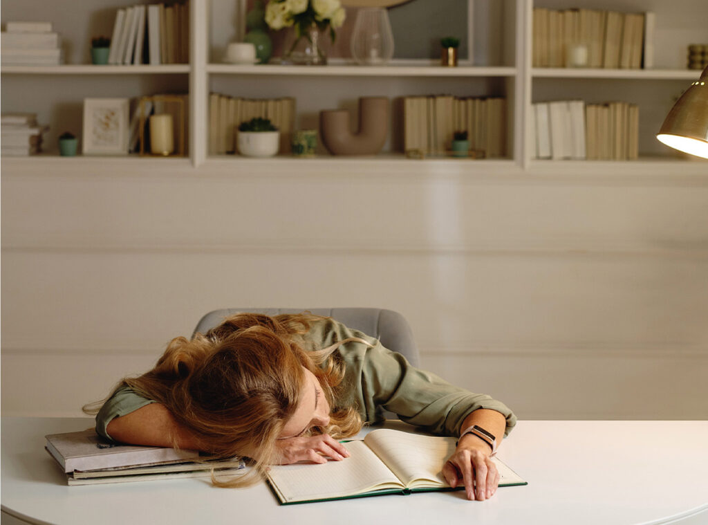 woman laying on a book